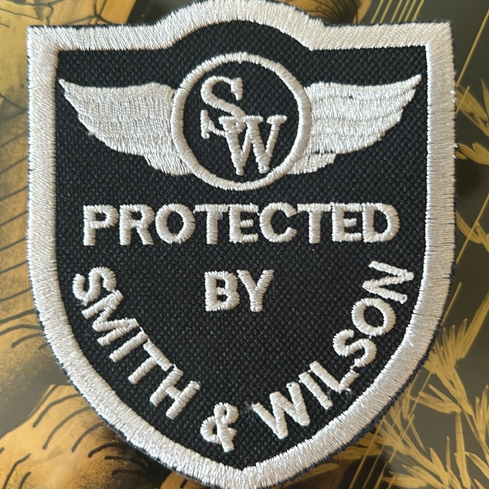 Protected by Smyth and Wilson, black and silver embroidered new patch ￼